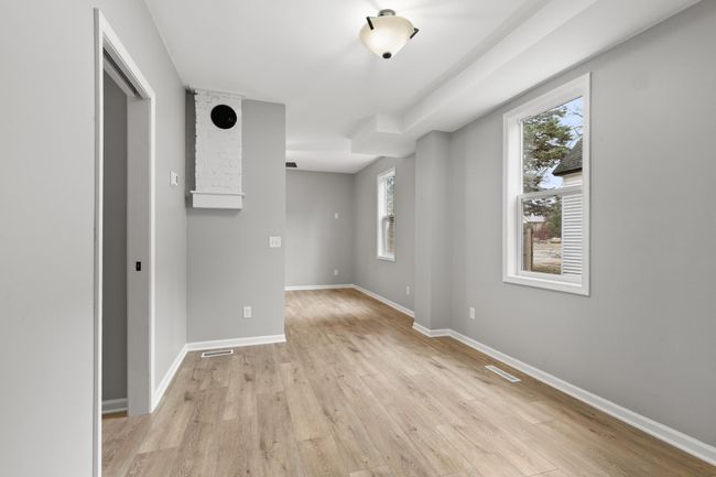 A view from the kitchen looking towards the dining and living rooms. | Image 15