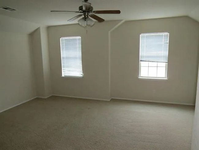 Bonus room featuring carpet flooring, ceiling fan, and vaulted ceiling | Image 4