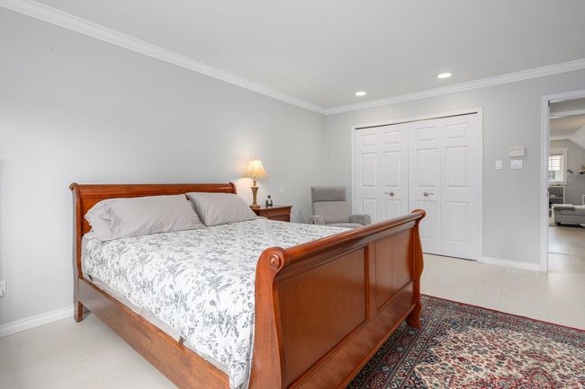 Bedroom with ornamental molding, a closet, and recessed lighting | Image 16