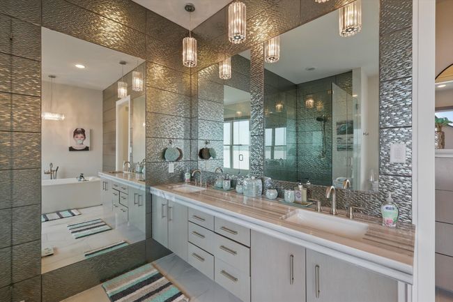 Bathroom with a stall shower, tile patterned floors, a sink, and tasteful backsplash | Image 30