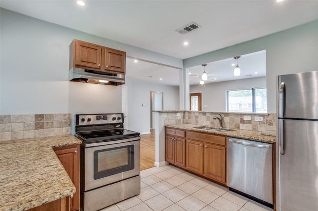 Good storage with dishwasher, electric range and SS fridge included. | Image 4