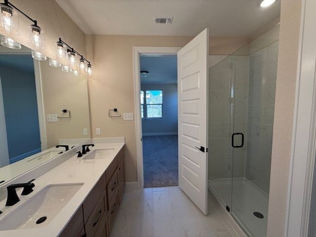 Primary Bath with walk-in shower and dual vanities | Image 7