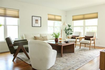 Living room. Windows face North and front of home East. Nice natural lighting through out the day. | Image 1