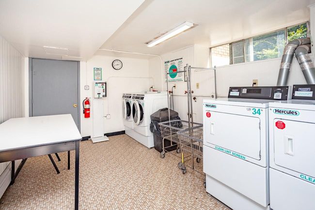 Community laundry with washing machine and clothes dryer | Image 18