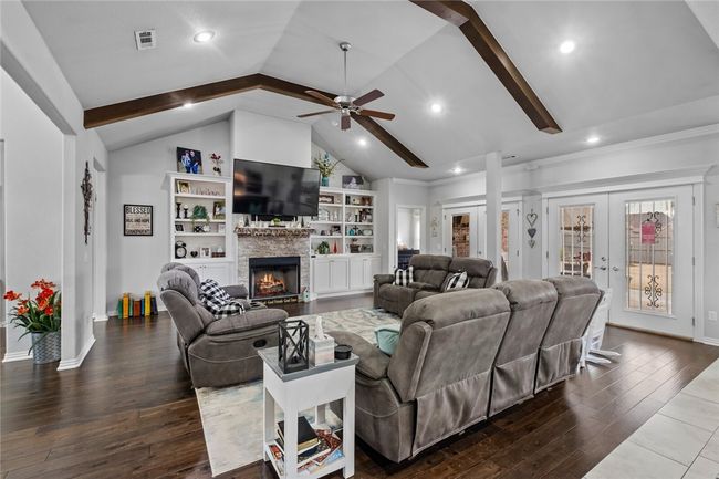Stunning living room. Bedroom 2 to the left, Master bedroom to the right of fireplace and book case. | Image 16