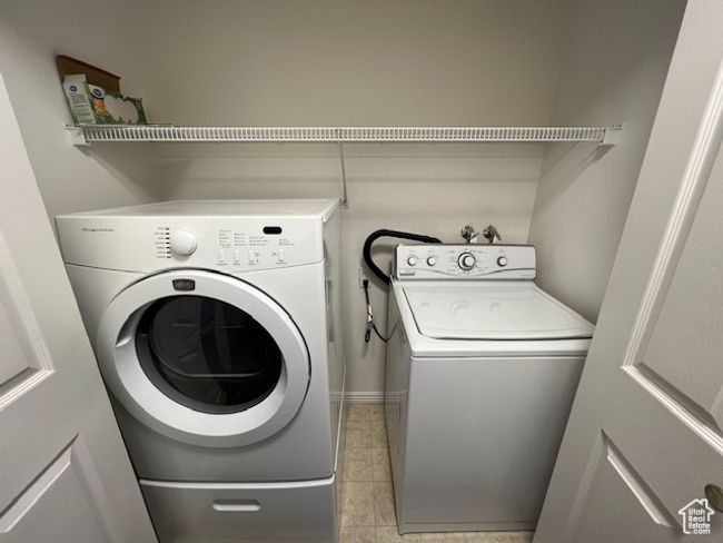 Laundry area featuring washer and clothes dryer and laundry area | Image 7