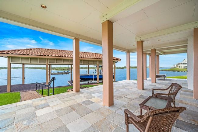 This home provides access to the backyard boathouse, with a direct path from the home leading to the water, making it ideal for boating and waterfront relaxation | Image 39