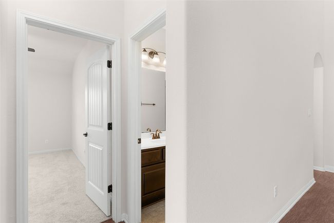 Hall featuring carpet and baseboards | Image 15