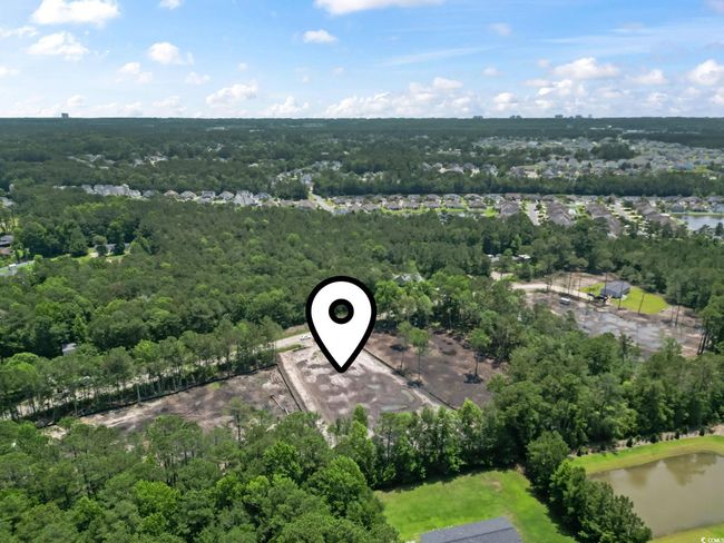 View of property location with a forest and a nearby body of water | Image 7