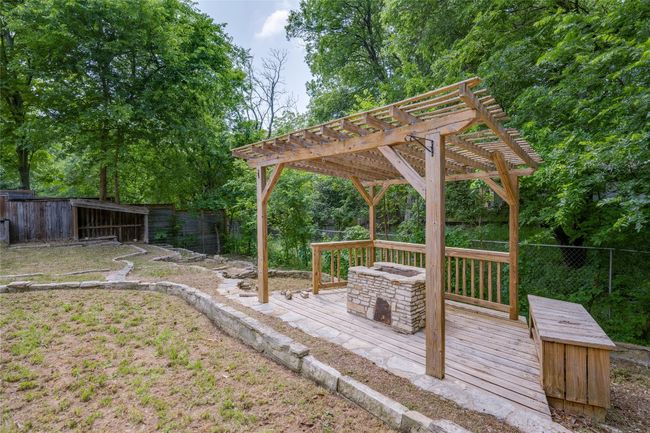 View of yard featuring a fenced backyard, a pergola, and a wooden deck | Image 31