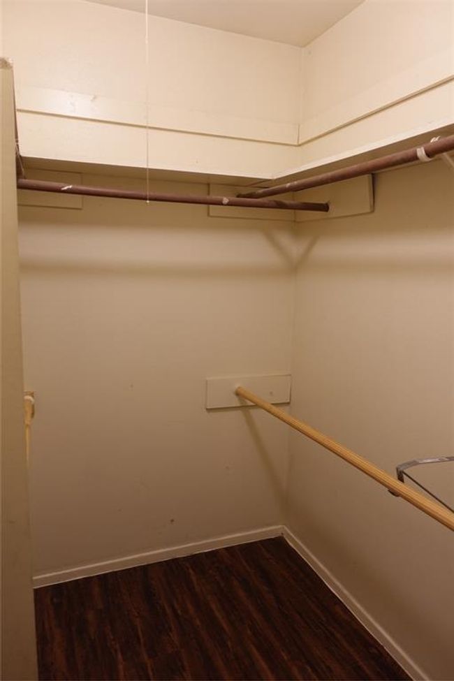Expansive master bedroom walk-in closet offering ample storage space and organization potential. | Image 23