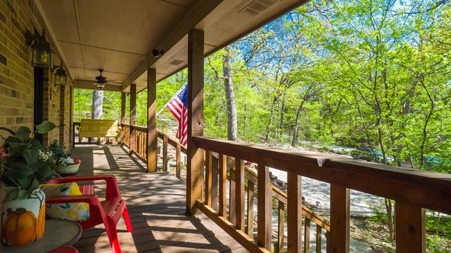 Deck with a porch and visible vents | Image 25