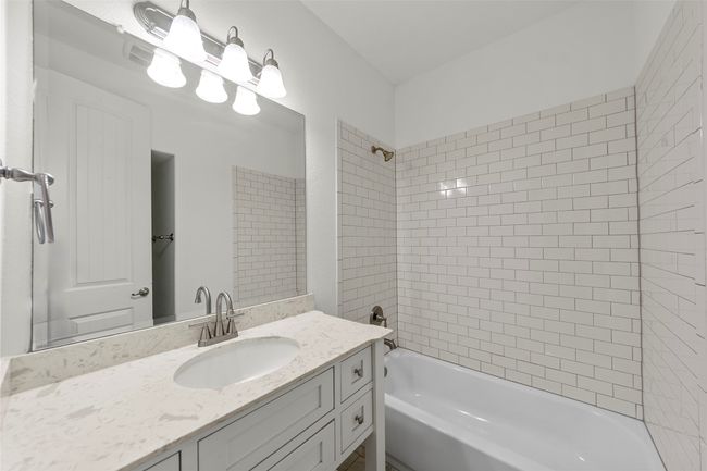 Bathroom with vanity and shower combination | Image 32