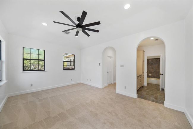 Included is a walk-in wardrobe storage closet and a private dressing area. | Image 38