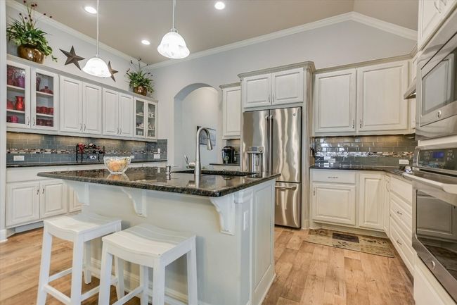 Upgraded cabinets and stainless appliances. | Image 4