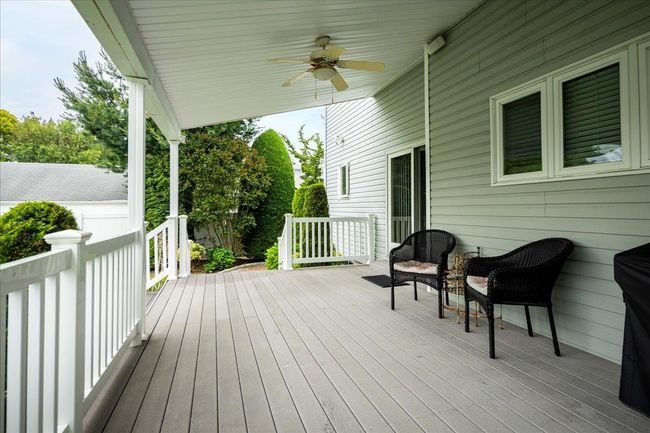 Wooden terrace featuring a ceiling fan | Image 31