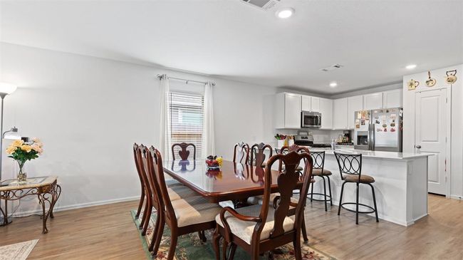 dining area open to the kitchen | Image 6