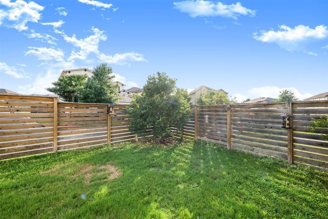 View of fenced backyard | Image 31