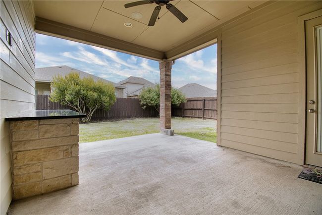 View of patio / terrace featuring a fenced backyard and a ceiling fan | Image 21