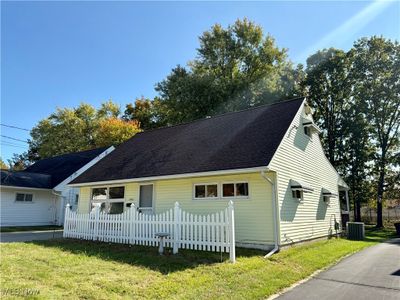 View of front facade featuring central air condition unit and a front lawn | Image 2