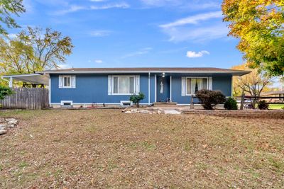 Ranch-style home featuring a carport | Image 3