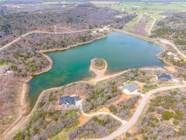 Aerial overview of property's location featuring a nearby body of water | Image 14