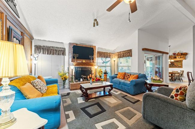 View of your living room from a different angle. Notice all the natural lighting. | Image 12