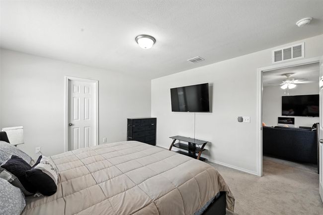 Bedroom with light colored carpet and baseboards | Image 32