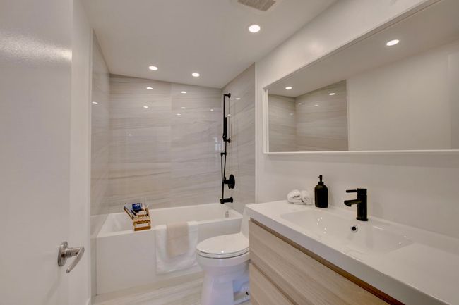 Bathroom with vanity, recessed lighting, and shower / bath combination | Image 16