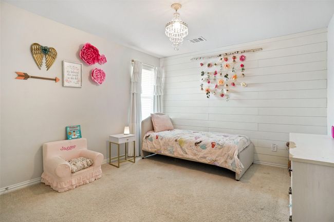 Bedroom featuring carpet floors, a chandelier, and baseboards | Image 15