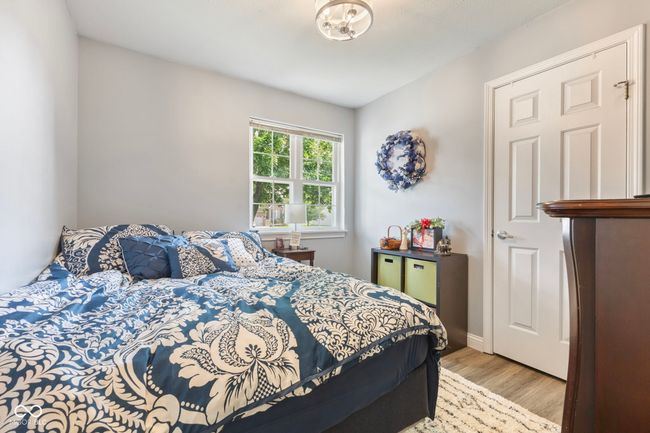 bedroom with wood finished floors | Image 14