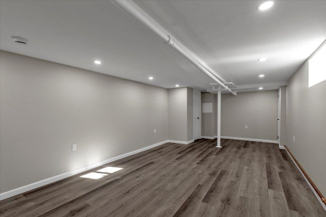 Basement featuring hardwood / wood-style flooring | Image 13