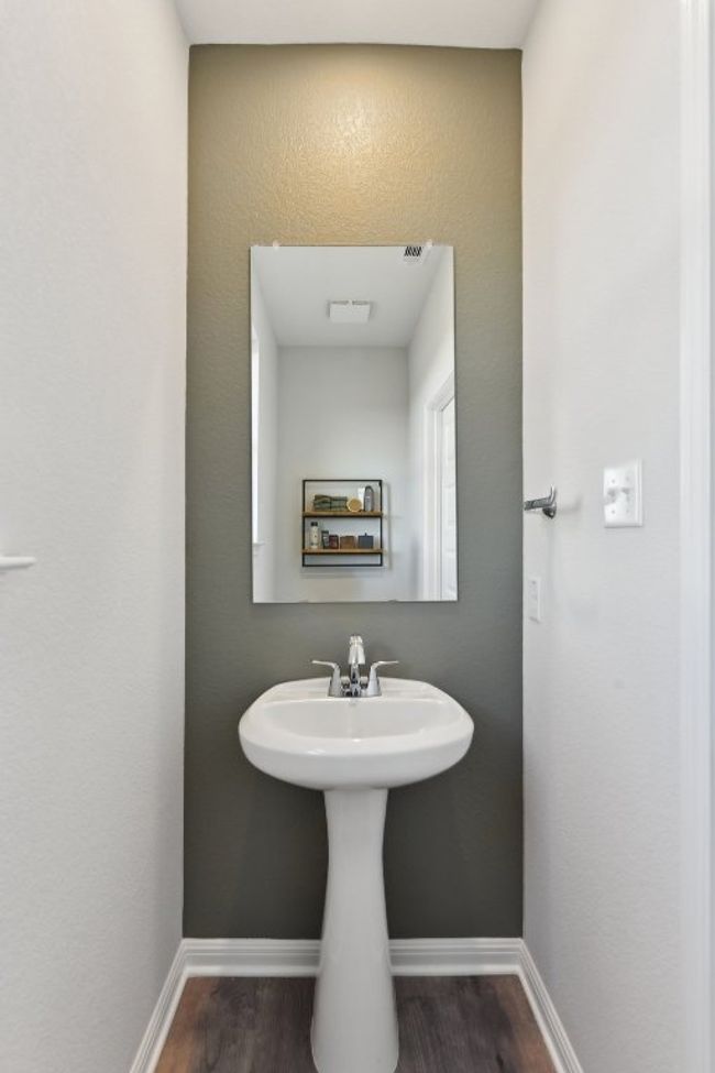 Bathroom with wood finished floors and baseboards | Image 17