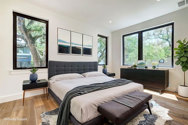 Bedroom with light wood-style flooring, recessed lighting, and baseboards | Image 12