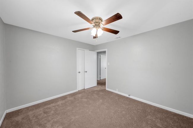 Unfurnished bedroom featuring carpet floors and ceiling fan | Image 13