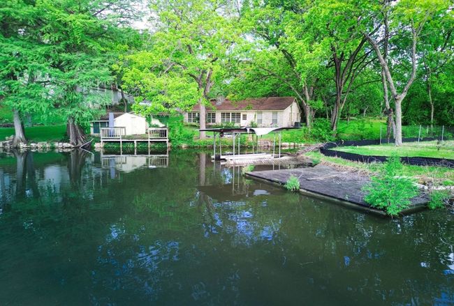 This property is permitted for a one-slip boat dock. | Image 6