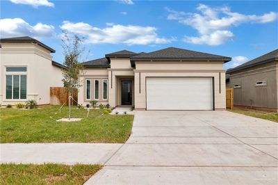 Prairie-style house with a front yard and a garage | Image 2