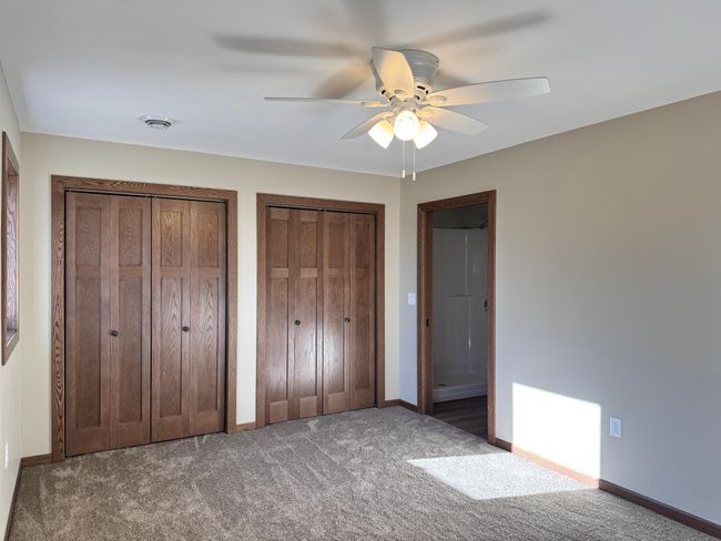 This bedroom features direct access to private 3/4 bathroom. | Image 8