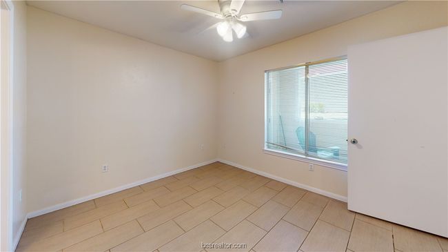 Spare room featuring ceiling fan | Image 24