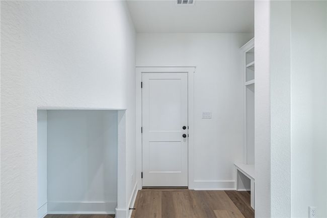 Mudroom featuring wood-type flooring | Image 24