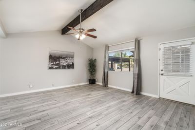 LOVELY PLANK TILE FLOORING, 3" CONTEMPORARY BASEBOARDS & UPDATED INTERIOR 2 PANEL DOORS THROUGHOUT! | Image 2