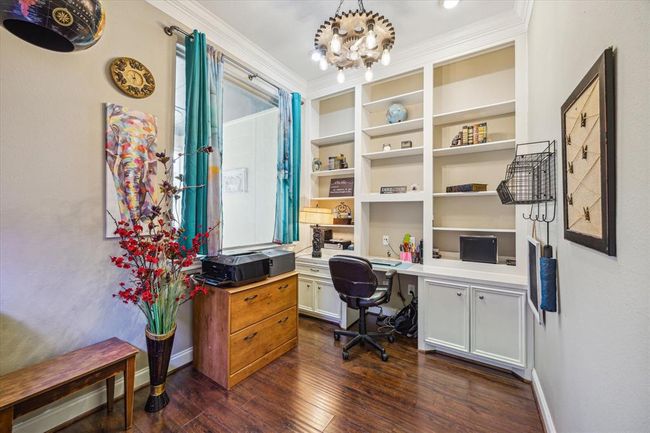 Second office space with built in cabinets. Just off the hallway to the PM bedroom on first floor | Image 14