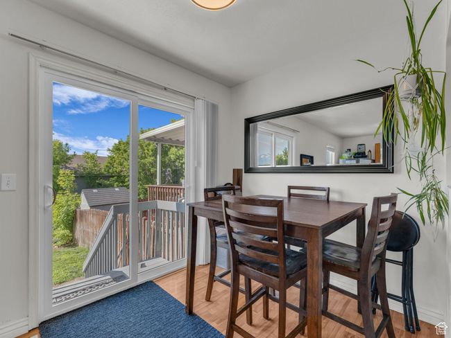 Dining room featuring wood finished floors | Image 14