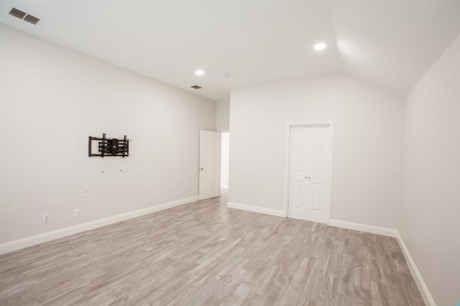 Bonus room featuring light wood-style flooring, vaulted ceiling, and recessed lighting | Image 39