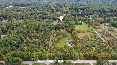 3121 Groveland Road, Home with 3 bedrooms, 2 bathrooms and null parking in Groveland Twp MI | Image 2