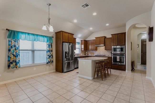 Dining area and kitchen are large enough for many sizes of dining tables. | Image 7