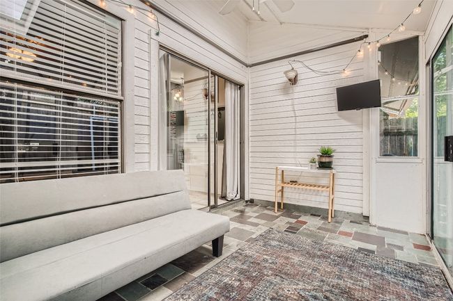 View of patio / terrace with a ceiling fan | Image 17