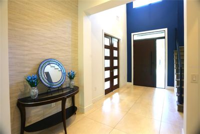 Foyer. Beautiful wooden glass doors to the left of the picture lead to bonus room perfect for whatever you would like. | Image 2