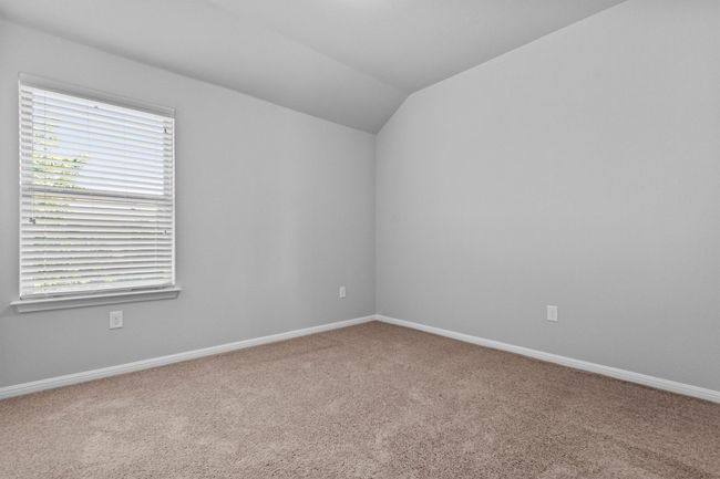 Spare room with carpet flooring, lofted ceiling, plenty of natural light, and baseboards | Image 20