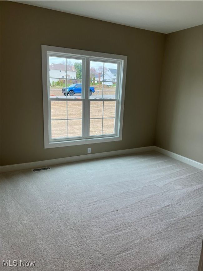 Carpeted empty room with baseboards | Image 15